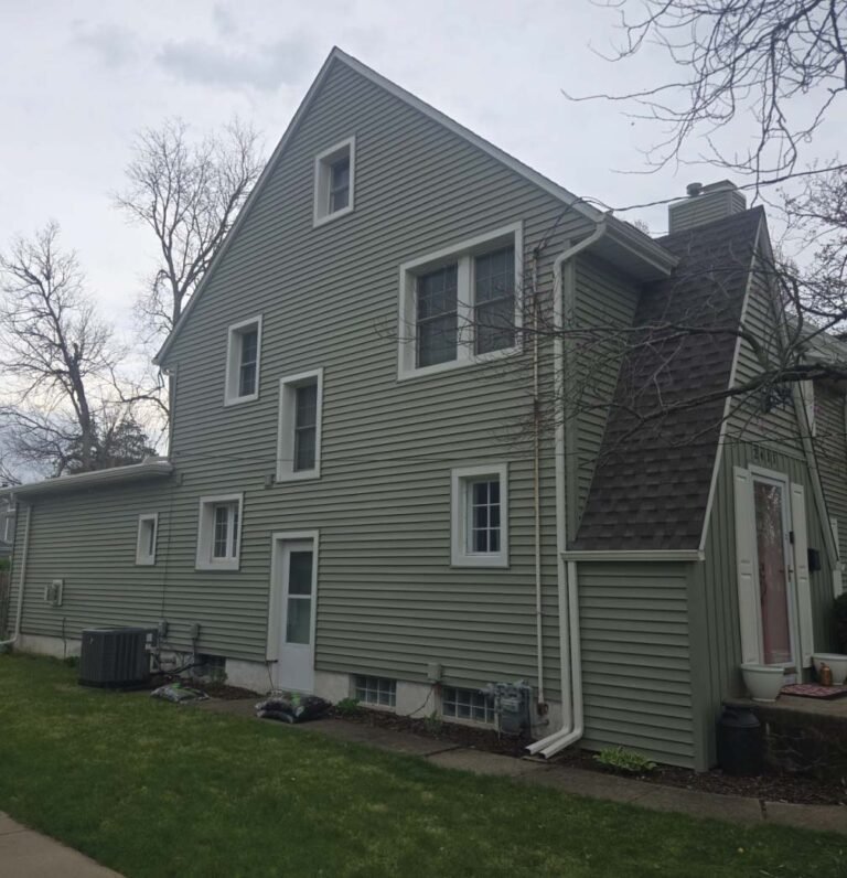 Professional installation of durable vinyl siding on a residential property in Central Illinois.