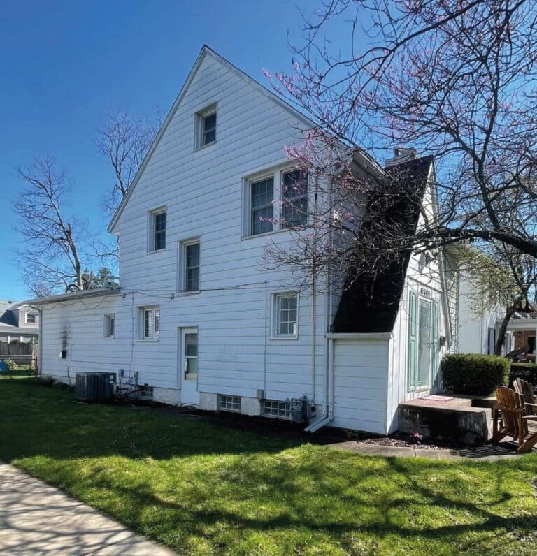 A beautifully restored Peoria home featuring a complete exterior overhaul including new roofing and gutter systems.